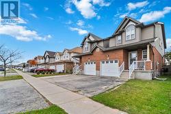 View of front of house with a front lawn and a garage - 