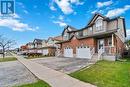 View of front of house with a front lawn and a garage - 42 Donnenwerth Drive, Kitchener, ON  - Outdoor With Facade 