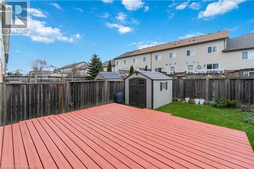 Wooden terrace featuring a lawn and a storage shed - 42 Donnenwerth Drive, Kitchener, ON - Outdoor