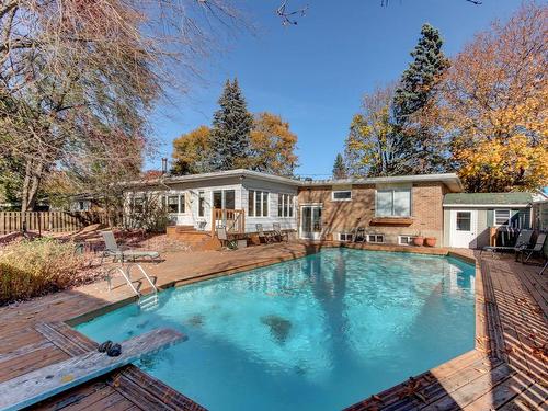 Pool - 1951 Rue De Bedford, Saint-Bruno-De-Montarville, QC - Outdoor With In Ground Pool With Deck Patio Veranda