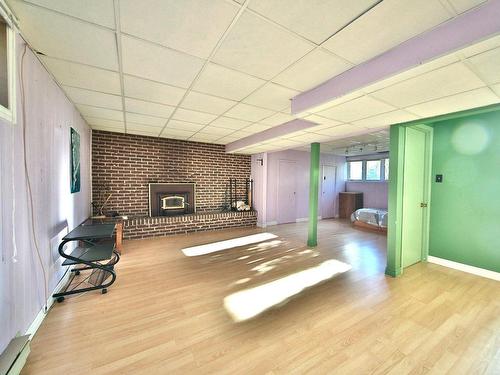 Family room - 1040 Rue Dolbeau, Saint-Bruno-De-Montarville, QC - Indoor Photo Showing Other Room With Fireplace