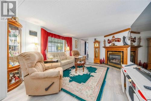 5700 Blackwell Sideroad Unit# 30, Sarnia, ON - Indoor Photo Showing Living Room With Fireplace