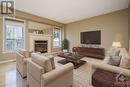 112 Grovemont Drive, Ottawa, ON  - Indoor Photo Showing Living Room With Fireplace 