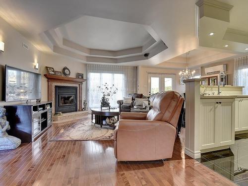 Living room - 265 Rue Grillon, Saint-Paul, QC - Indoor Photo Showing Living Room With Fireplace