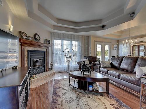 Living room - 265 Rue Grillon, Saint-Paul, QC - Indoor Photo Showing Living Room With Fireplace