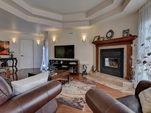 Living room - 265 Rue Grillon, Saint-Paul, QC - Indoor Photo Showing Living Room With Fireplace