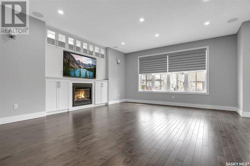 105 Oxbow Crescent, Regina, SK - Indoor Photo Showing Living Room With Fireplace