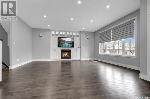 105 Oxbow Crescent, Regina, SK - Indoor Photo Showing Living Room With Fireplace