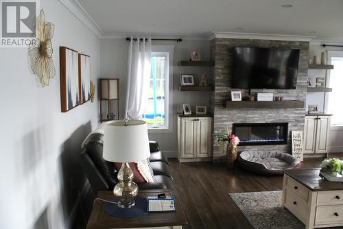 369 A Main Street, Mcivers, NL - Indoor Photo Showing Living Room With Fireplace