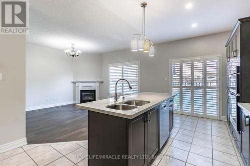 3259 Scotch Pine Gate, Mississauga, ON - Indoor Photo Showing Kitchen With Fireplace With Double Sink