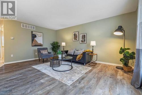 Living room featuring hardwood / wood-style flooring - 24 Kenyon Crescent Unit# 45, Grimsby, ON - Indoor Photo Showing Living Room