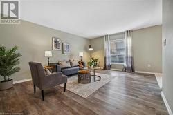 Living room featuring dark hardwood / wood-style floors - 