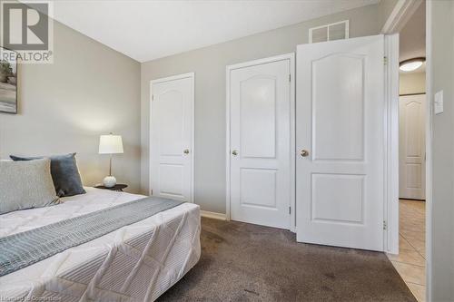 View of carpeted bedroom - 24 Kenyon Crescent Unit# 45, Grimsby, ON - Indoor Photo Showing Bedroom