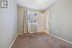 View of carpeted spare room - 