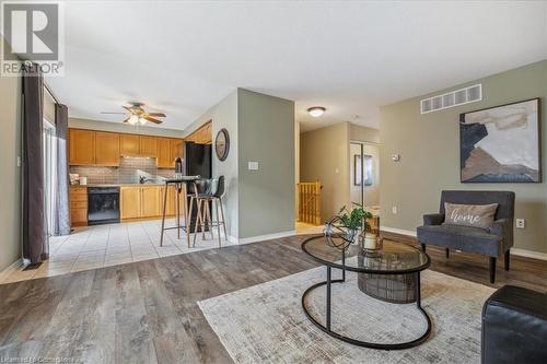 Living room featuring ceiling fan and light hardwood / wood-style floors - 24 Kenyon Crescent Unit# 45, Grimsby, ON - Indoor Photo Showing Living Room