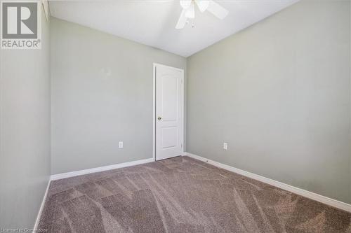 Unfurnished room with ceiling fan and carpet floors - 24 Kenyon Crescent Unit# 45, Grimsby, ON - Indoor Photo Showing Other Room