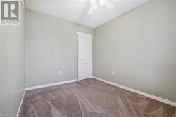 Unfurnished room with ceiling fan and carpet floors - 