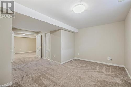 Unfurnished room featuring light carpet - 24 Kenyon Crescent Unit# 45, Grimsby, ON - Indoor Photo Showing Other Room