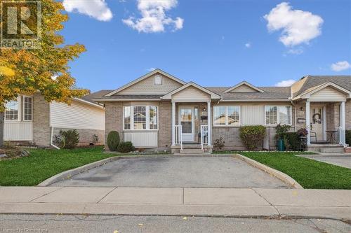 View of front of house with a front yard - 24 Kenyon Crescent Unit# 45, Grimsby, ON - Outdoor With Facade