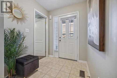 Tiled foyer entrance featuring a textured ceiling - 24 Kenyon Crescent Unit# 45, Grimsby, ON - Indoor Photo Showing Other Room