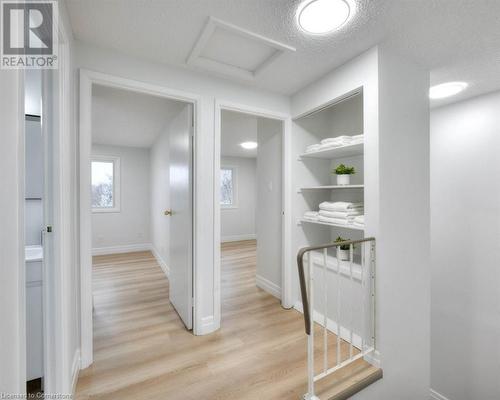 Hall with a textured ceiling and light hardwood / wood-style flooring - 24 Karen Walk, Waterloo, ON - Indoor Photo Showing Other Room