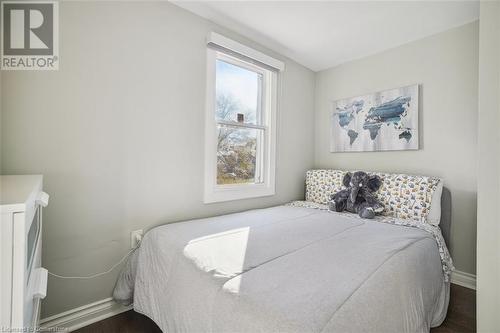 Bedroom featuring dark hardwood / wood-style flooring - 25 Rockwood Avenue, St. Catharines, ON - Indoor Photo Showing Bedroom