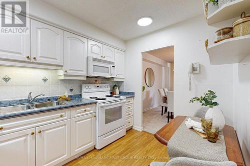 107 - 120 Elgin Street W, Oshawa, ON - Indoor Photo Showing Kitchen With Double Sink