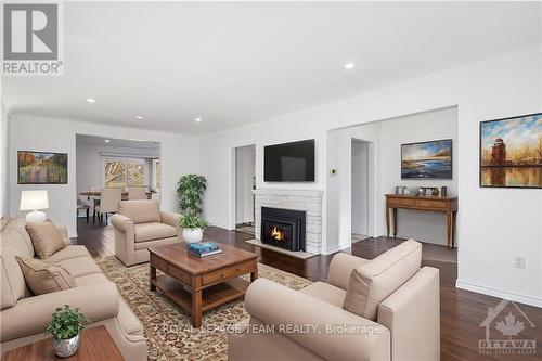 3629 Mcbean Street, Ottawa, ON - Indoor Photo Showing Living Room With Fireplace