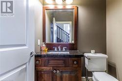 Bathroom with vanity and toilet - 