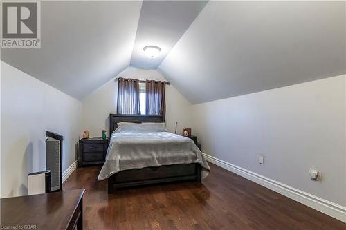 Bedroom with dark hardwood / wood-style flooring and vaulted ceiling - 59 Dominion Drive, Guelph, ON - Indoor Photo Showing Bedroom