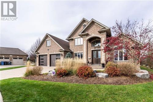 View of front of property with french doors and a front lawn - 59 Dominion Drive, Guelph, ON - Outdoor With Facade