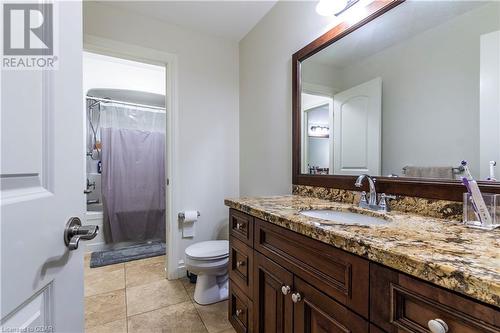 Bathroom featuring tile patterned floors, vanity, and toilet - 59 Dominion Drive, Guelph, ON - Indoor Photo Showing Bathroom