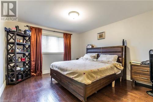 Bedroom with dark hardwood / wood-style floors - 59 Dominion Drive, Guelph, ON - Indoor Photo Showing Bedroom