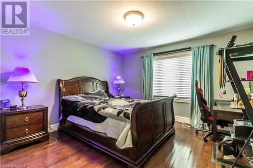 Bedroom featuring dark hardwood / wood-style floors - 59 Dominion Drive, Guelph, ON - Indoor Photo Showing Bedroom