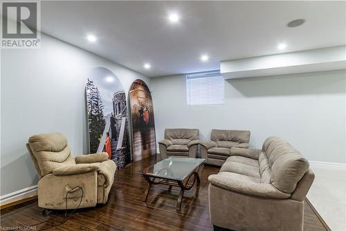 Living room with dark hardwood / wood-style flooring - 59 Dominion Drive, Guelph, ON - Indoor Photo Showing Basement