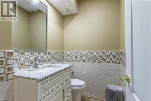 Bathroom with vanity, tile walls, and toilet - 59 Dominion Drive, Guelph, ON - Indoor Photo Showing Bathroom