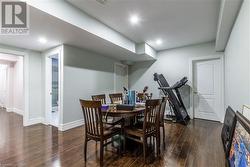 Dining room with dark hardwood / wood-style floors - 