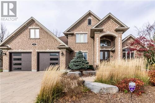 View of front of house with a garage - 59 Dominion Drive, Guelph, ON - Outdoor With Facade