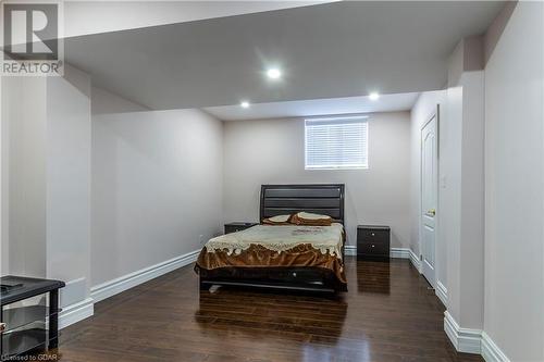 Bedroom featuring dark hardwood / wood-style floors - 59 Dominion Drive, Guelph, ON - Indoor Photo Showing Bedroom