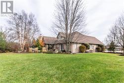 View of front of property featuring a front lawn - 