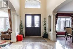 Foyer entrance with a healthy amount of sunlight and ornamental molding - 