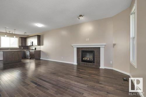 5921 168A Av Nw, Edmonton, AB - Indoor Photo Showing Living Room With Fireplace