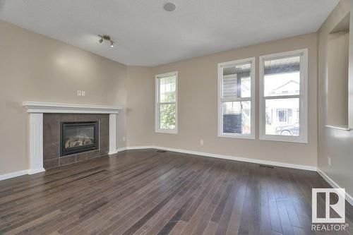 5921 168A Av Nw, Edmonton, AB - Indoor Photo Showing Living Room With Fireplace