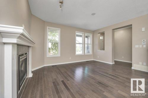 5921 168A Av Nw, Edmonton, AB - Indoor Photo Showing Other Room With Fireplace