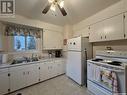 28 Mowat Place, Regina, SK  - Indoor Photo Showing Kitchen With Double Sink 