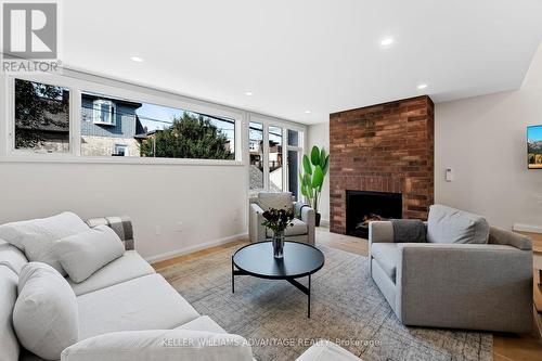 Rear - 386 Concord Avenue, Toronto, ON - Indoor Photo Showing Living Room With Fireplace