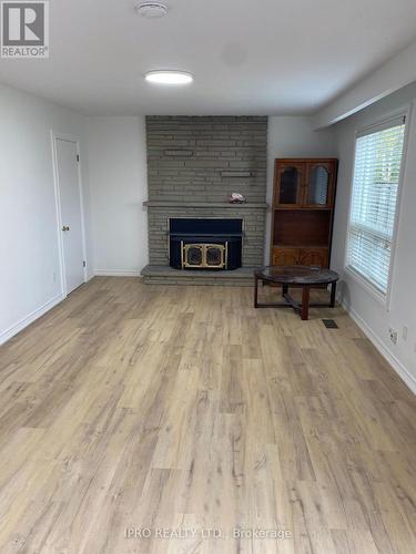 Lower - 3635 Bluestream Crescent, Mississauga, ON - Indoor Photo Showing Living Room With Fireplace