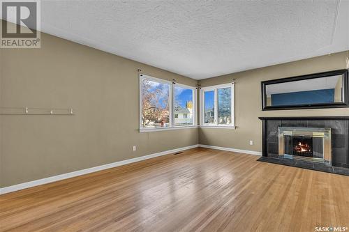 1514 Ewart Avenue S, Saskatoon, SK - Indoor Photo Showing Living Room With Fireplace