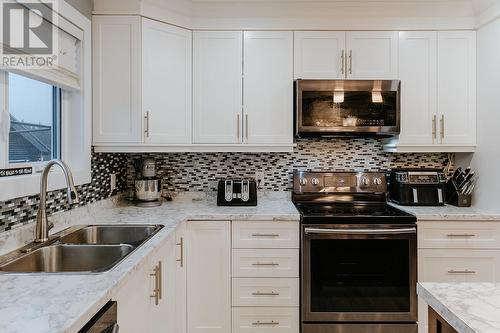 265 Main Street, Wing'S Point, NL - Indoor Photo Showing Kitchen With Double Sink