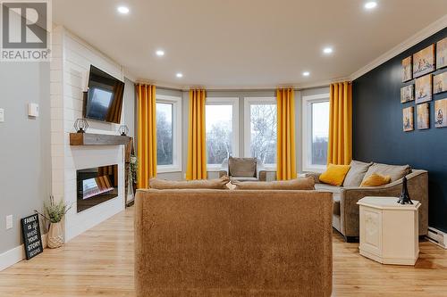 265 Main Street, Wing'S Point, NL - Indoor Photo Showing Living Room With Fireplace